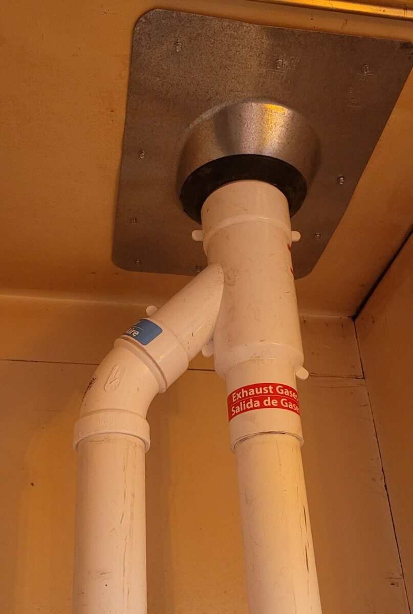 Two pipe venting, one intake and one exhaust, doesn't have to mean more holes in your house. This adapter has one pipe running inside the other.